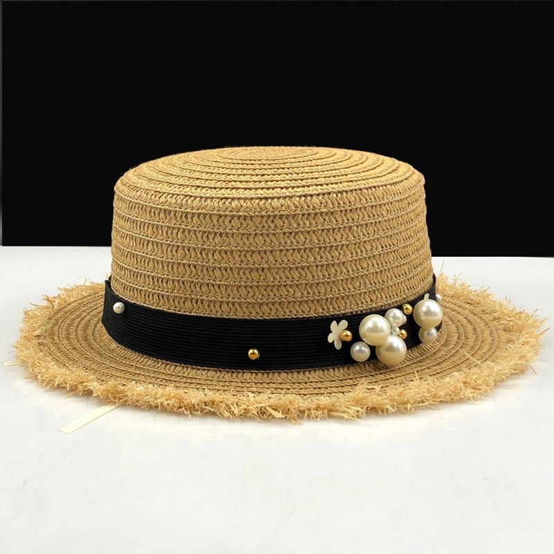 Dámsky slamený klobúk s ozdobou